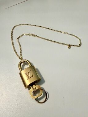 Louis Vuitton Authentic Louis Vuitton lock and key set #312 Gold With Chain